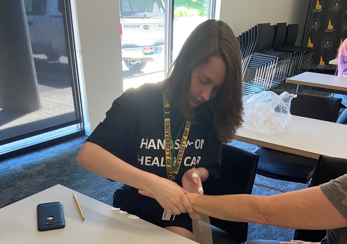 student working at hands on health care