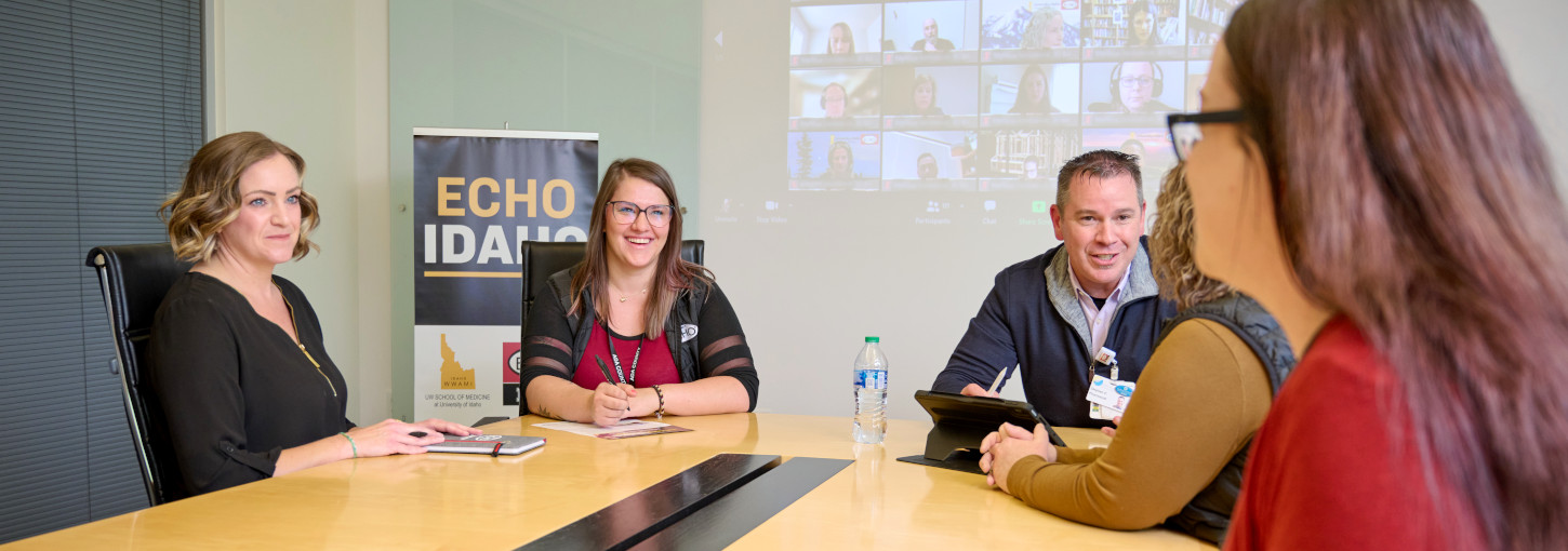 people sitting at a table collaborating