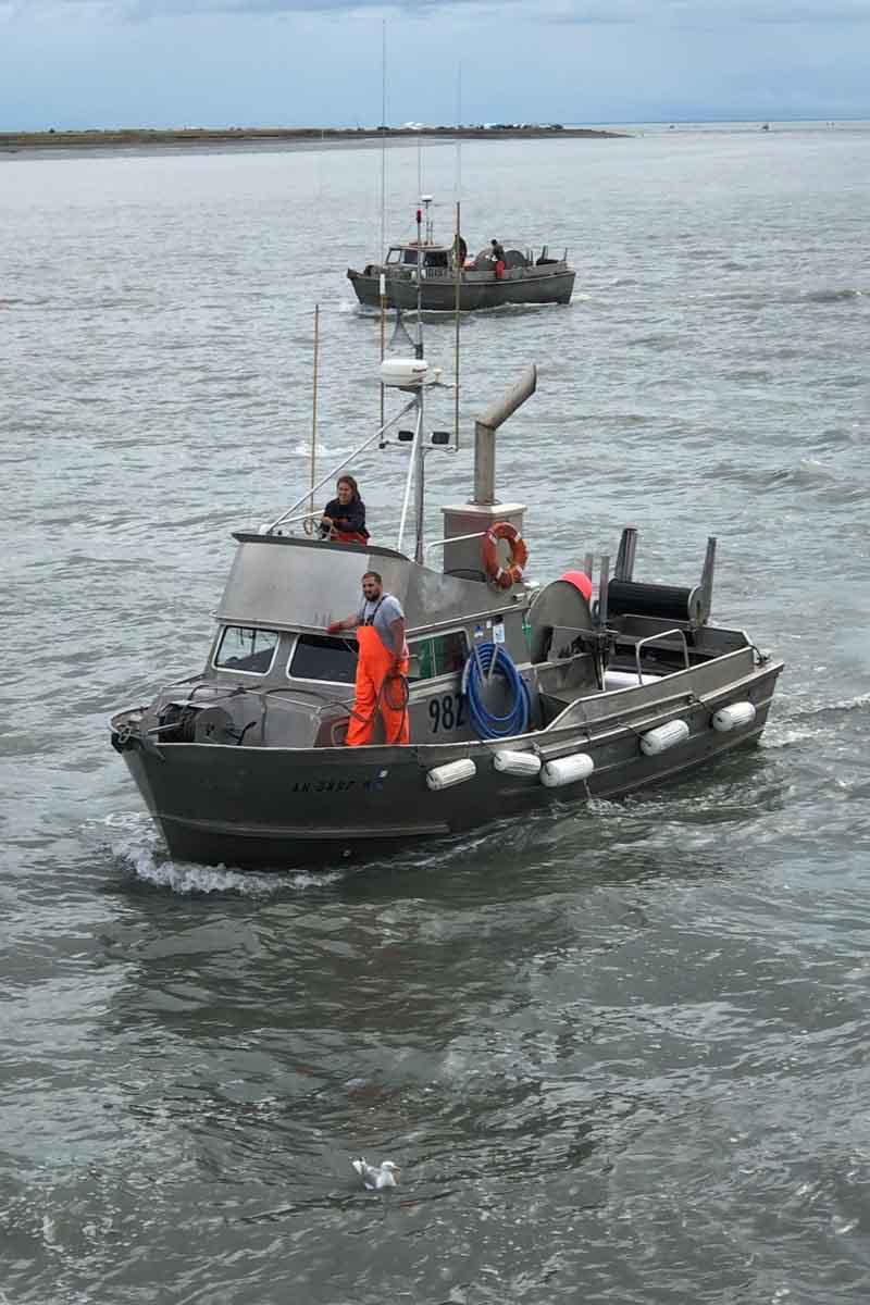 Two people on fishing boat in the ocean