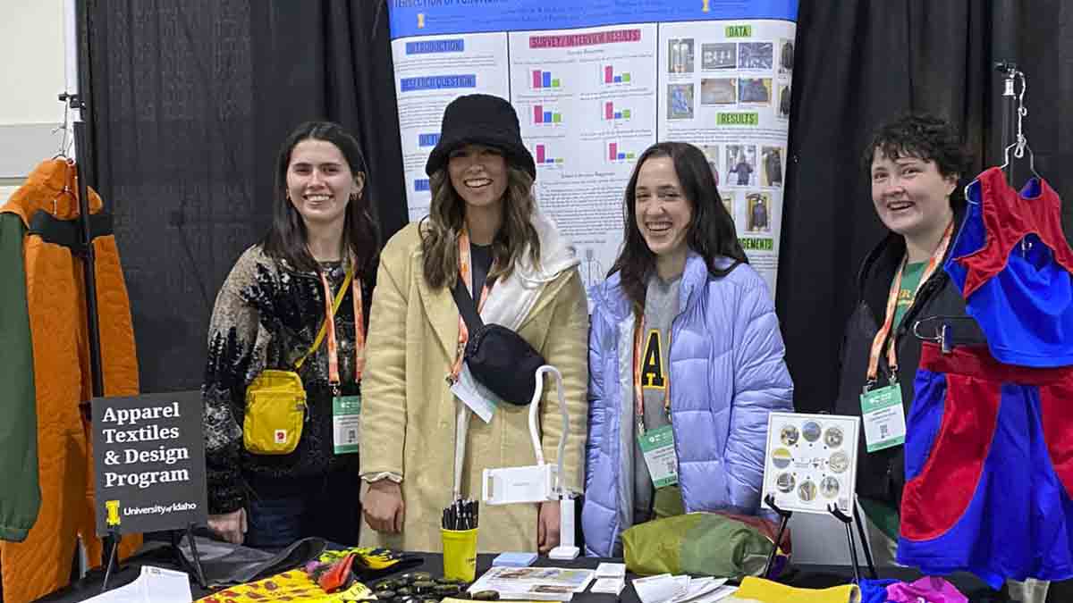 Women behind clothing display