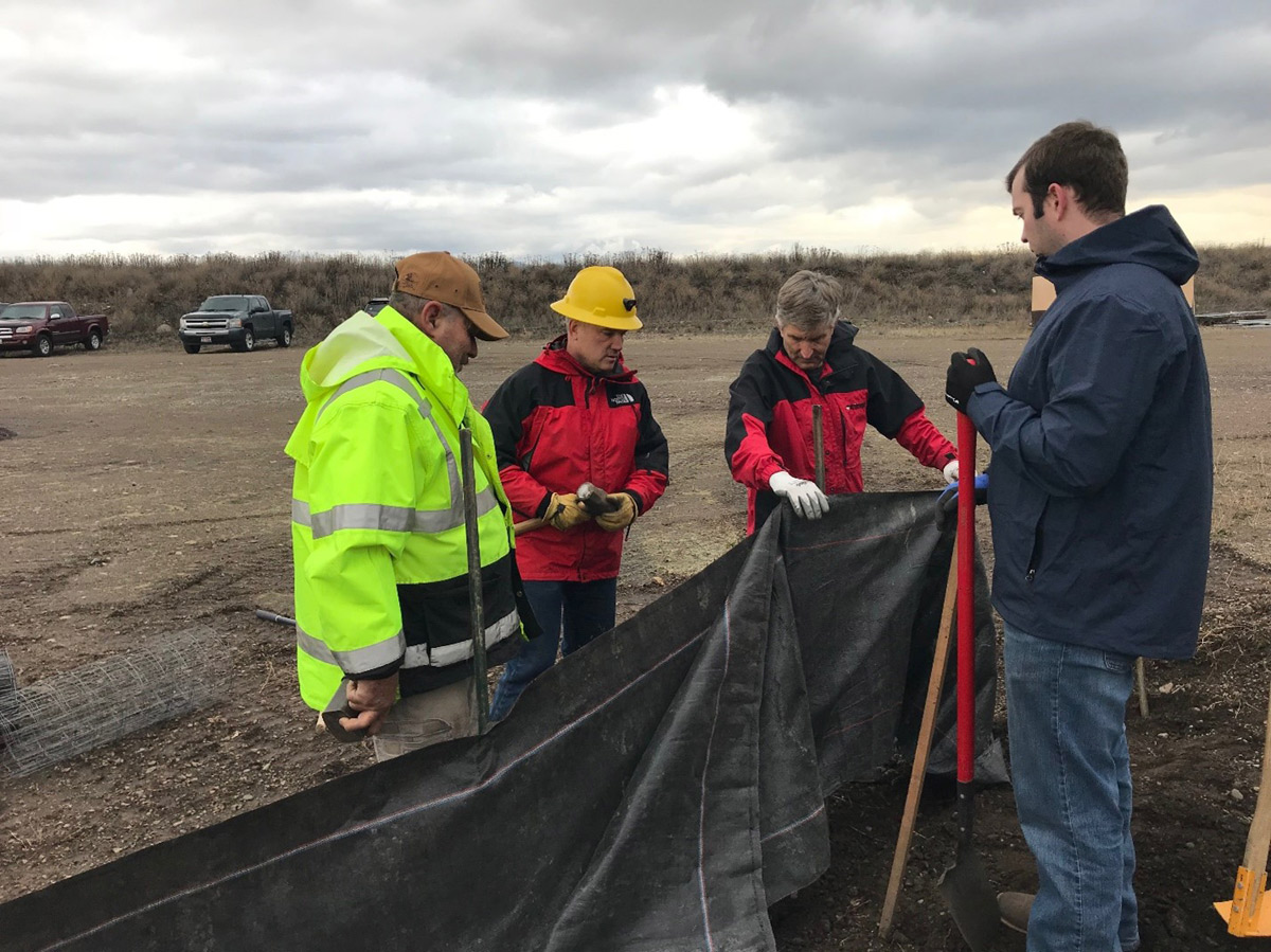 SEEP students hold a tarp.