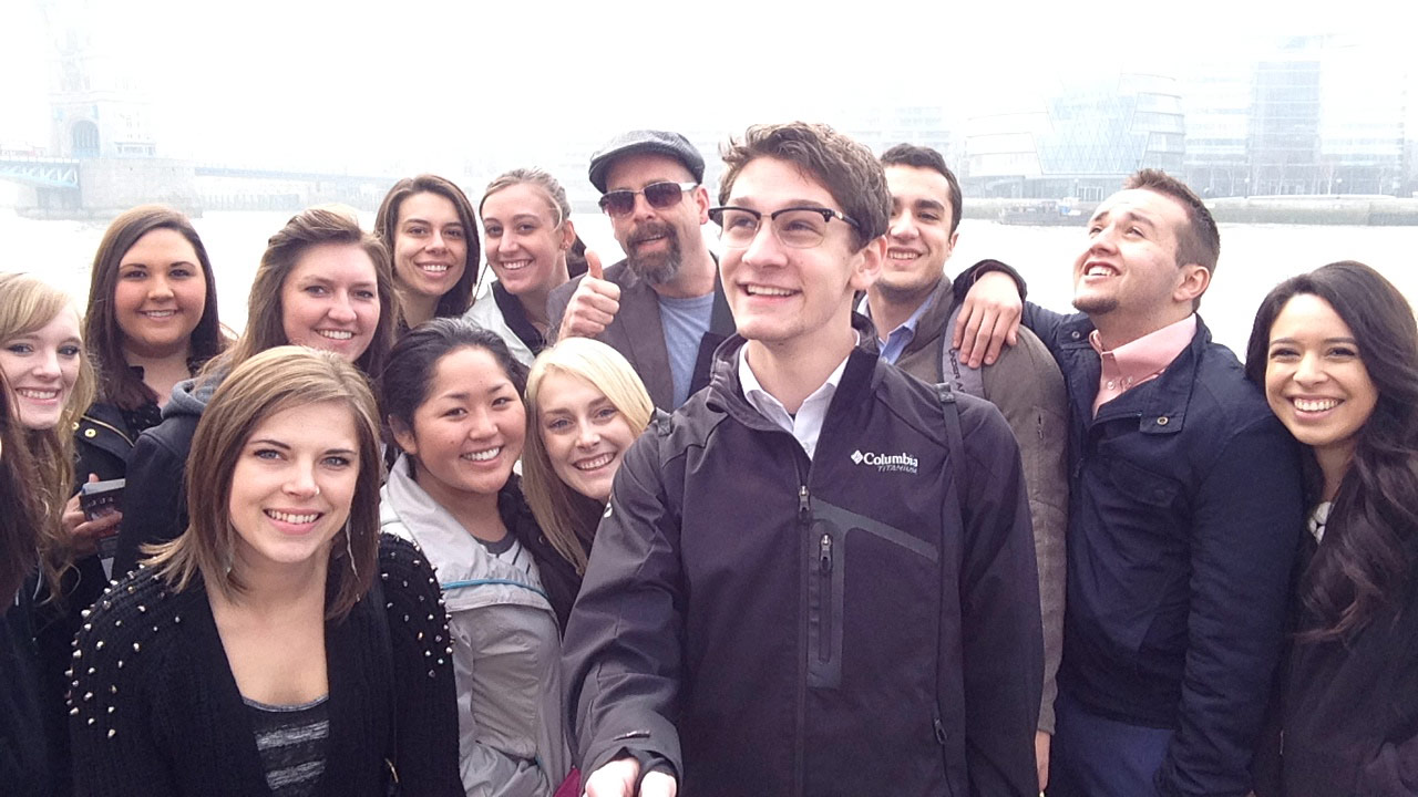 Brian Wolf and a group of students posing near the Thames.