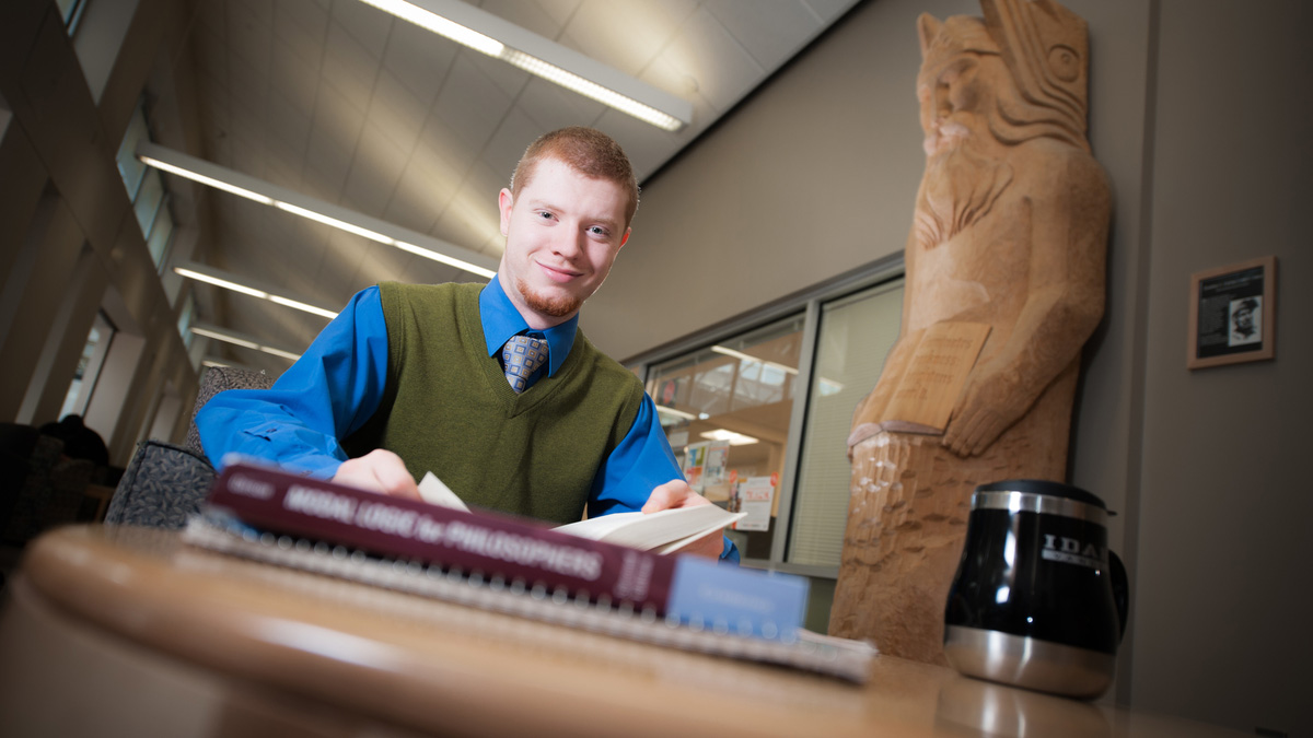 Cody Britson studying in the UI Commons.
