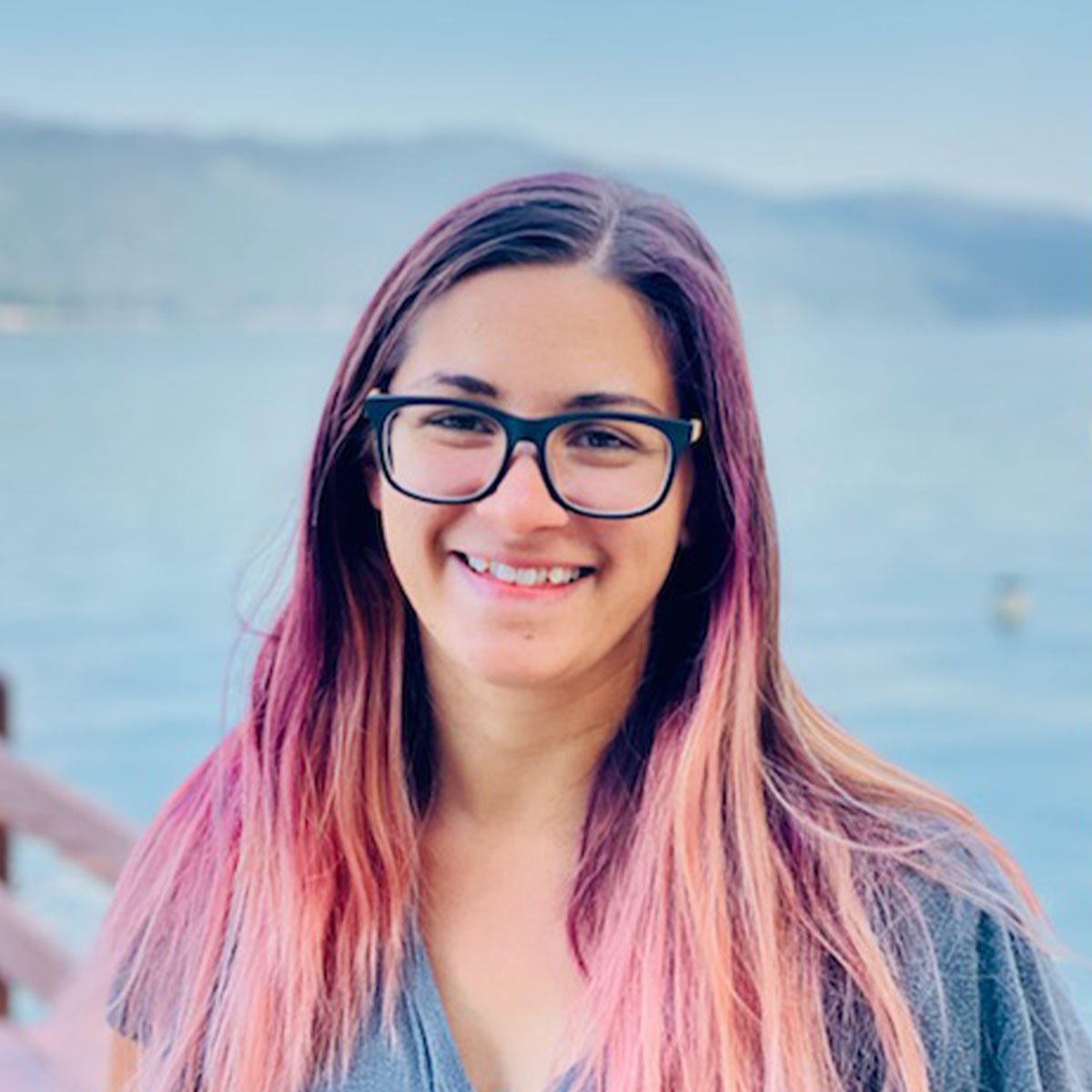 A portrait of Kaitlin Waterloo in front of a lake.
