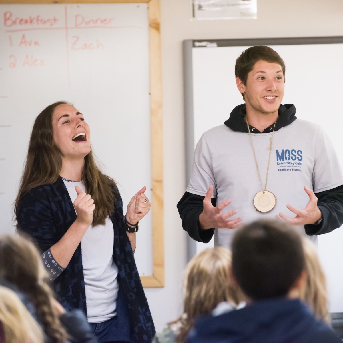 Two students laughing.