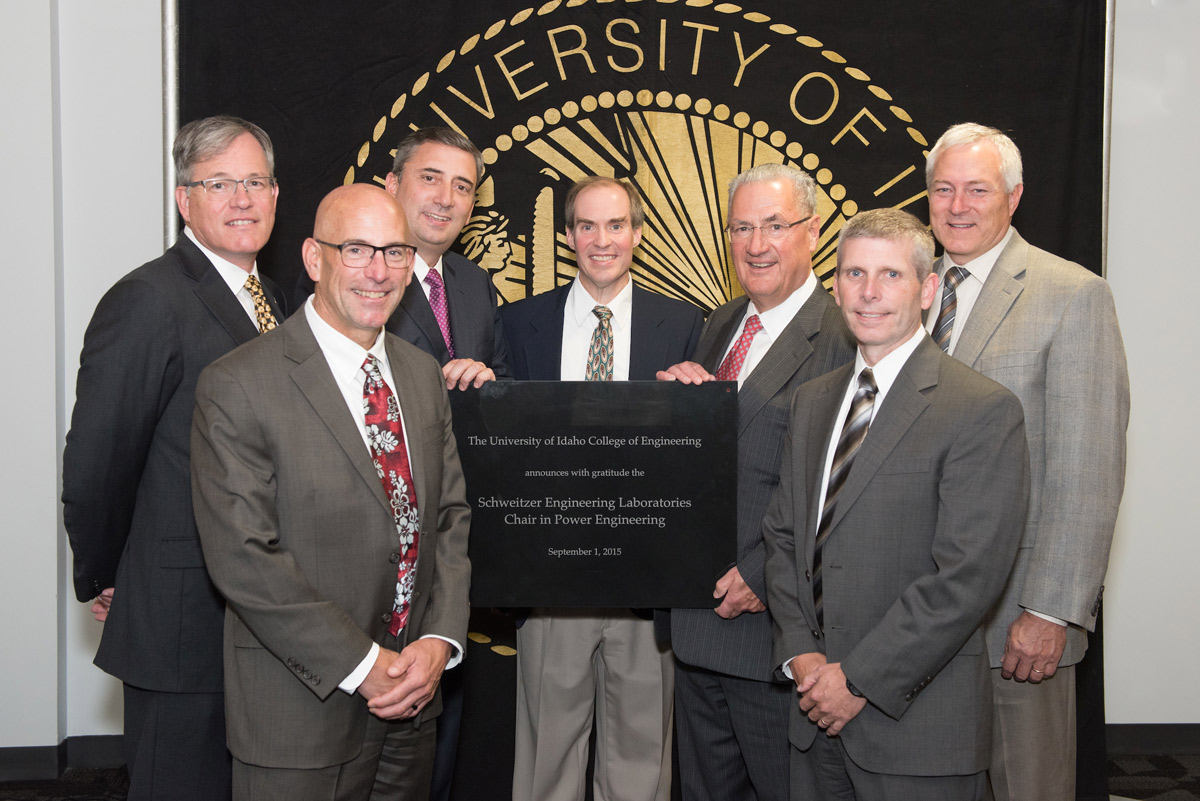 Brian Johnson with (left to right) former U of I President Chuck Staben, SEL executives Bob Morris, Luis D’Acosta, Edmund Schweitzer, Dave Whitehead and College of Engineering Dean Larry Stauffer