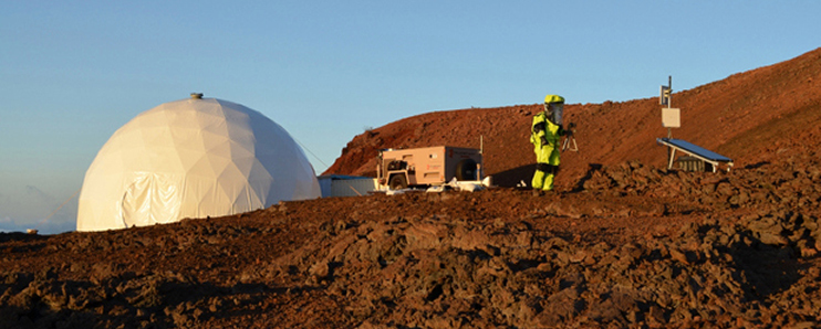 The HI-SEAS geodesic dome on the rocky landscape.