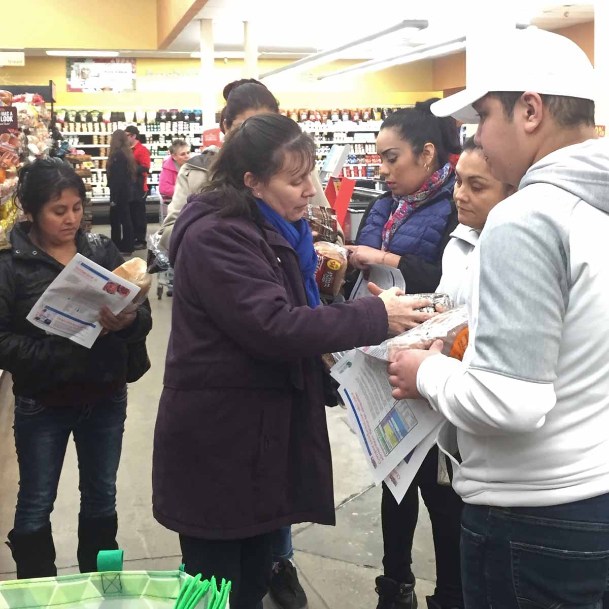 Group of people inside grocery store