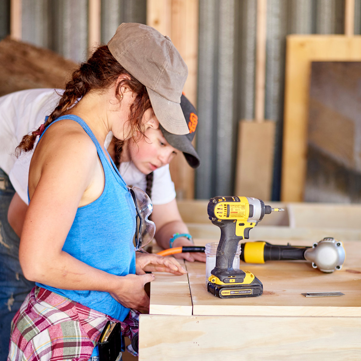 Two students assemble a countertop.