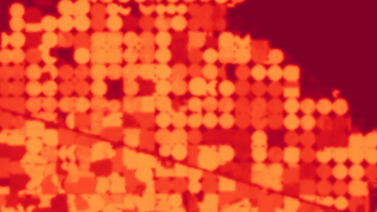 A map shows surface temperature of a group of center pivot fields Aug. 8, 2018, near Minidoka, Idaho, developed from Landsat by the University of Idaho. The darker red colors represent hotter temperatures and the lighter colors represent cooler temperatures associated with evapotranspiration from irrigated fields having large amounts of vegetation.