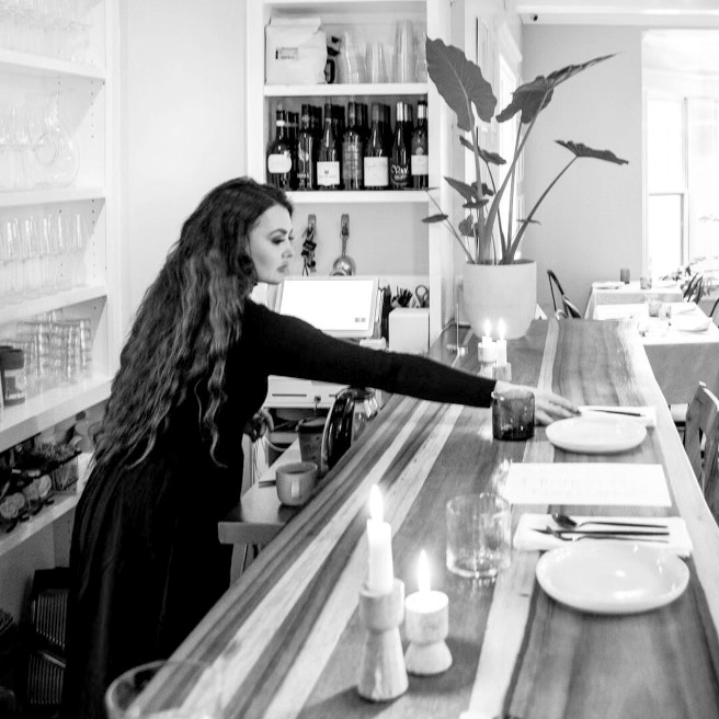 person preparing a counter top for a meal