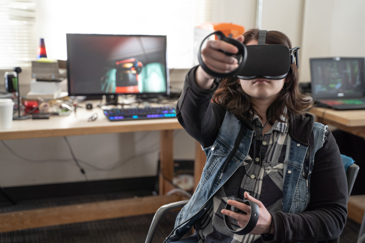 Student wearing VR goggles.