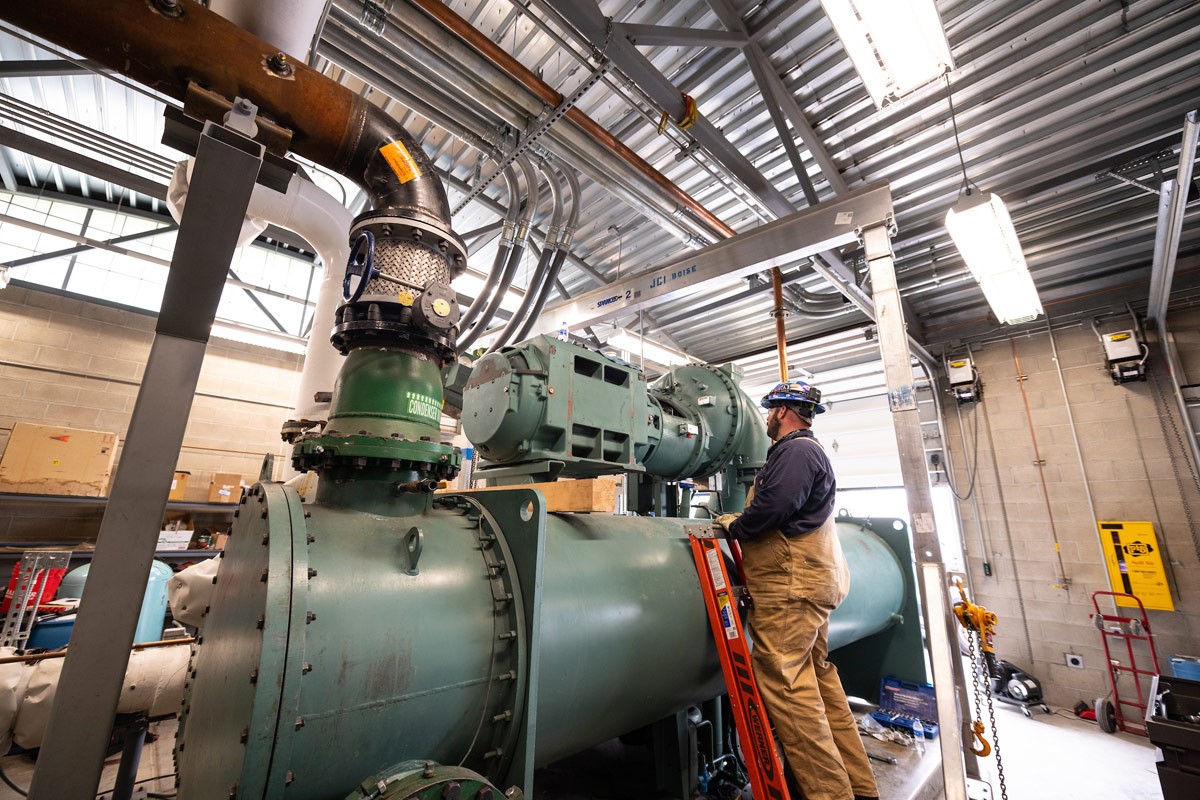 A man works on steam equipment.
