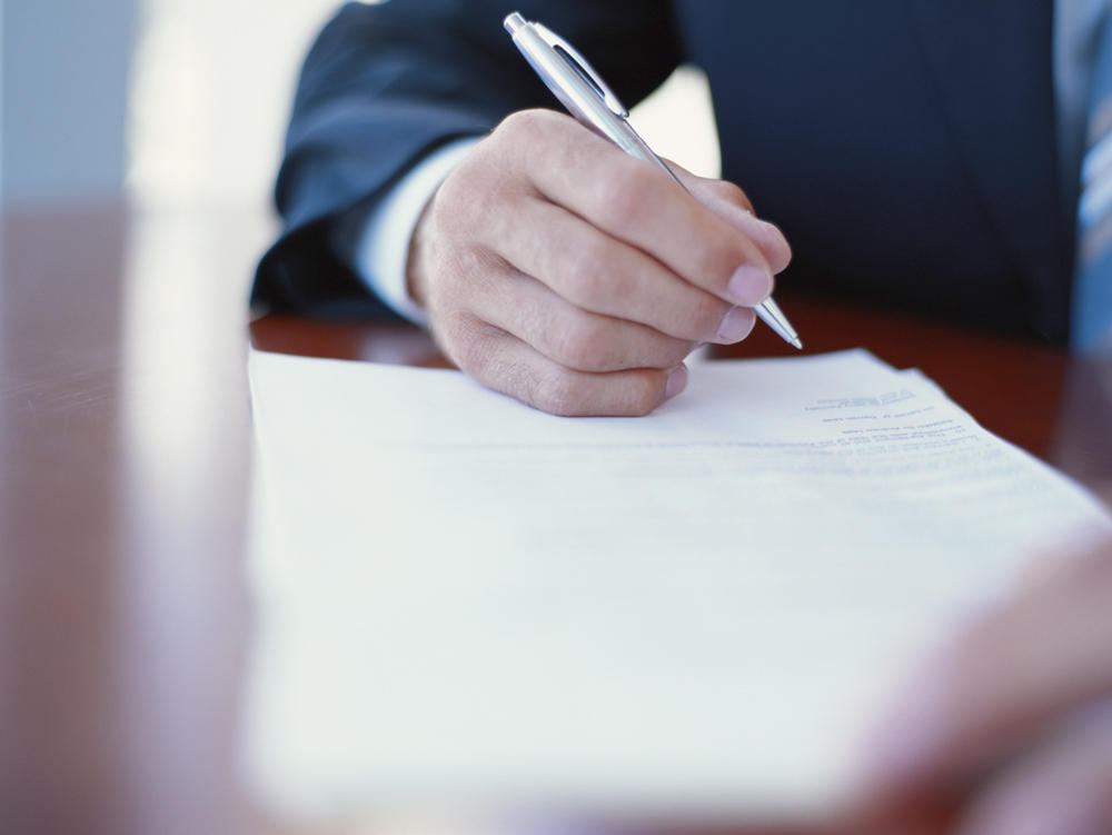 A man writing a letter A man writing a letter