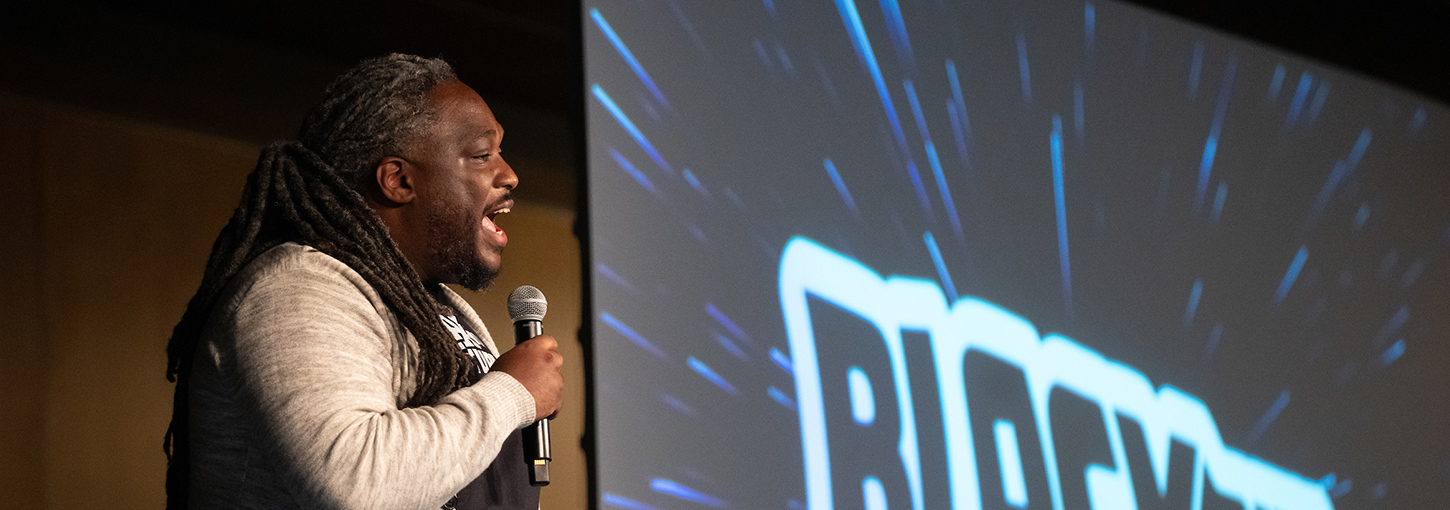 Sydney Freeman Jr. speaks on stage.