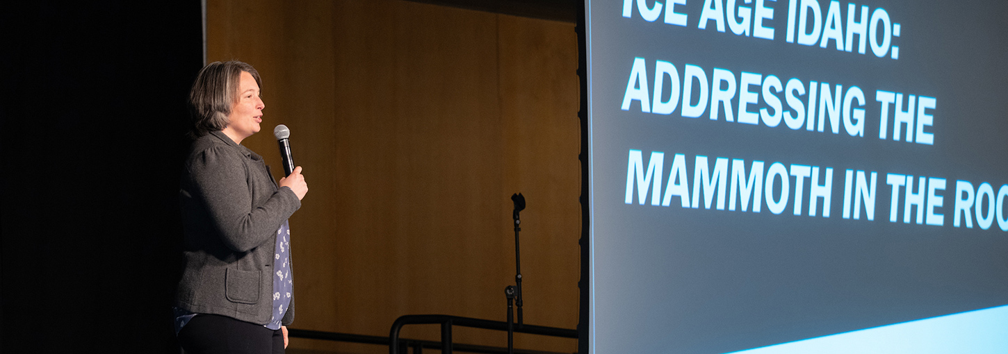 Renee Love speaks on stage.